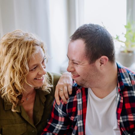 A woman and developmentally disabled man together at home