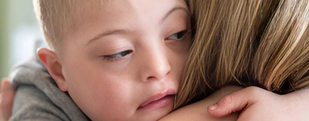 Child being hugged for support