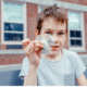 Elementary age boy playing with fidget spinner