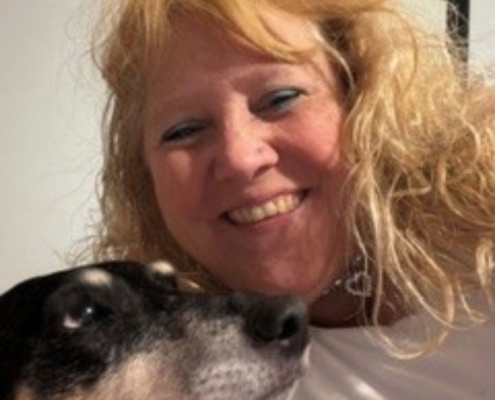 Sherry Phillips, a blonde woman pictured with her dog